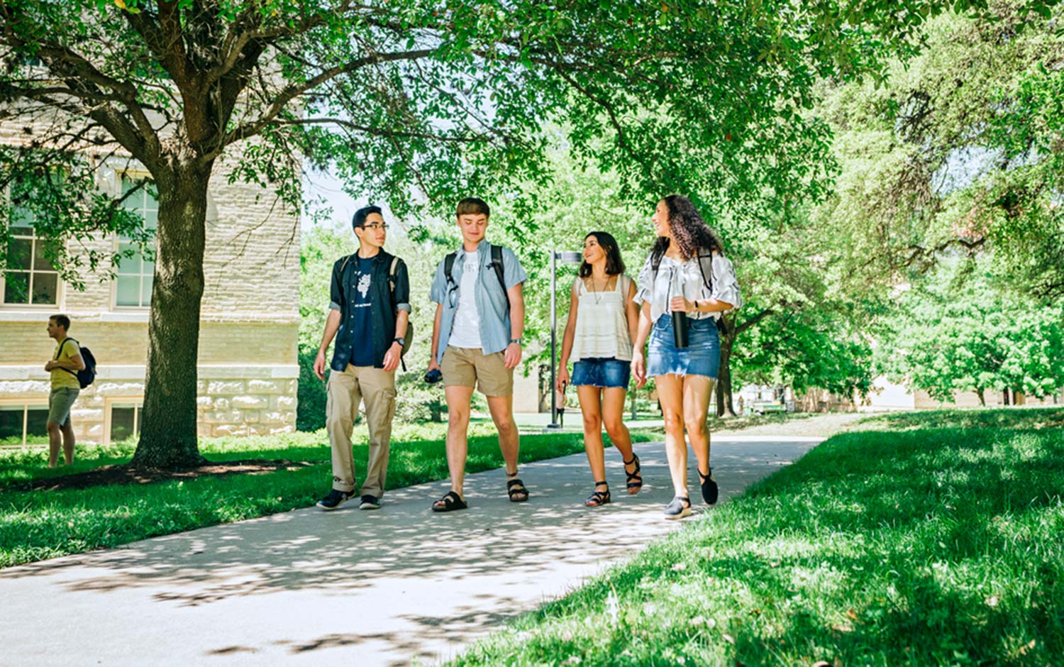 Students chat and walk through campus