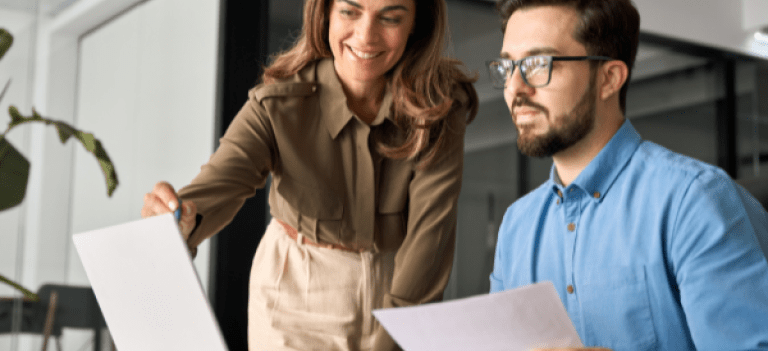 Business Man and Woman at Laptop