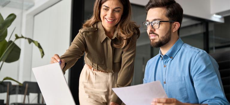 Male and female at computer