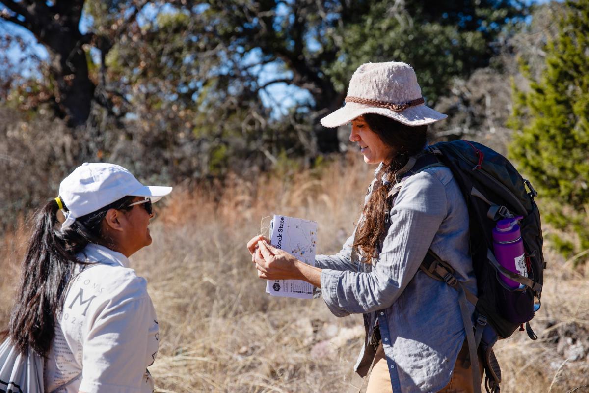 Professor Amy Concilio teaches a student at Enchanted Rock Natural State Area.
