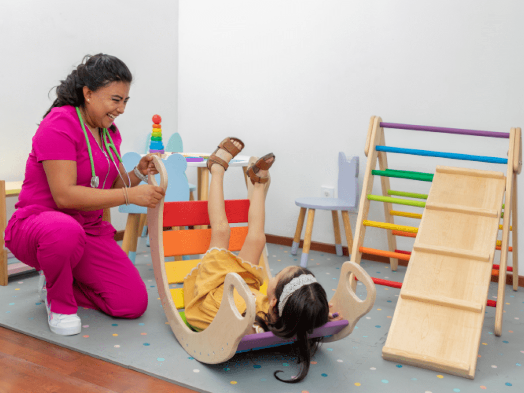 OT Professional teaches a child through play exercises