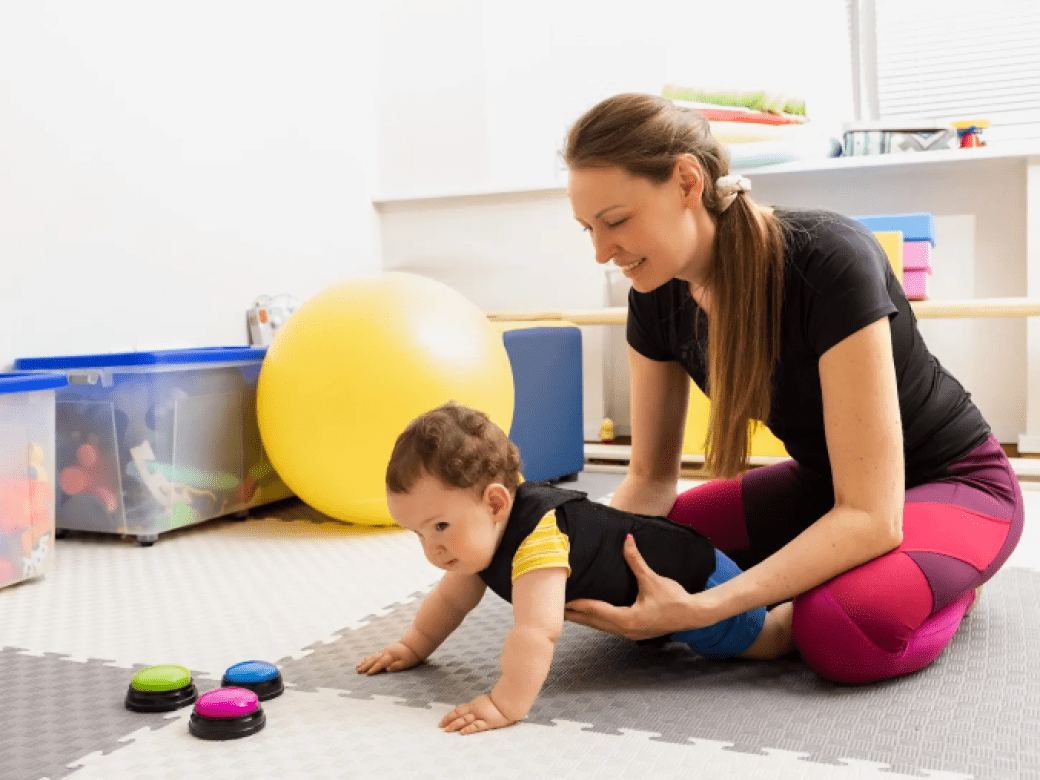 OT Professional teaches a toddler through play exercises