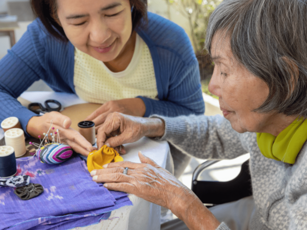OT Professional works with a senior patient