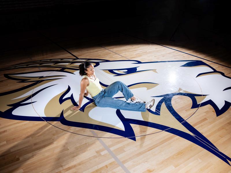 Suni Davis poses on the gym court