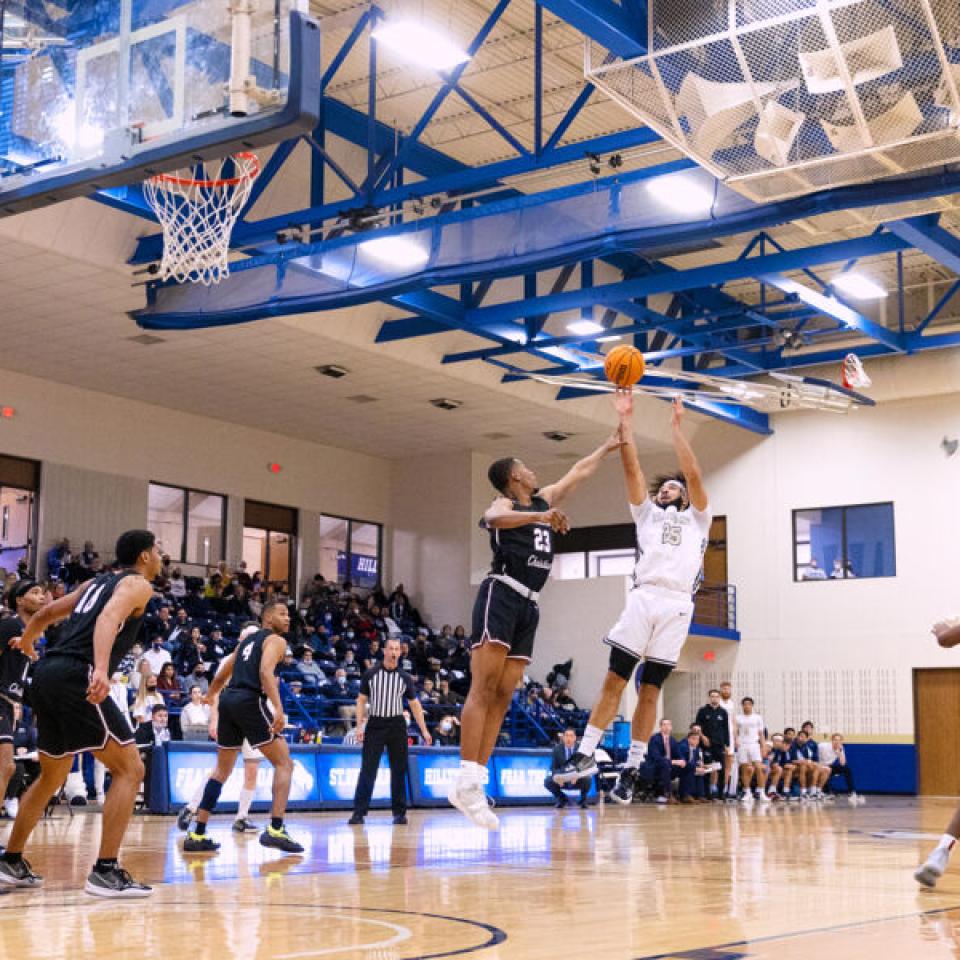men's basketball player shooting a shot