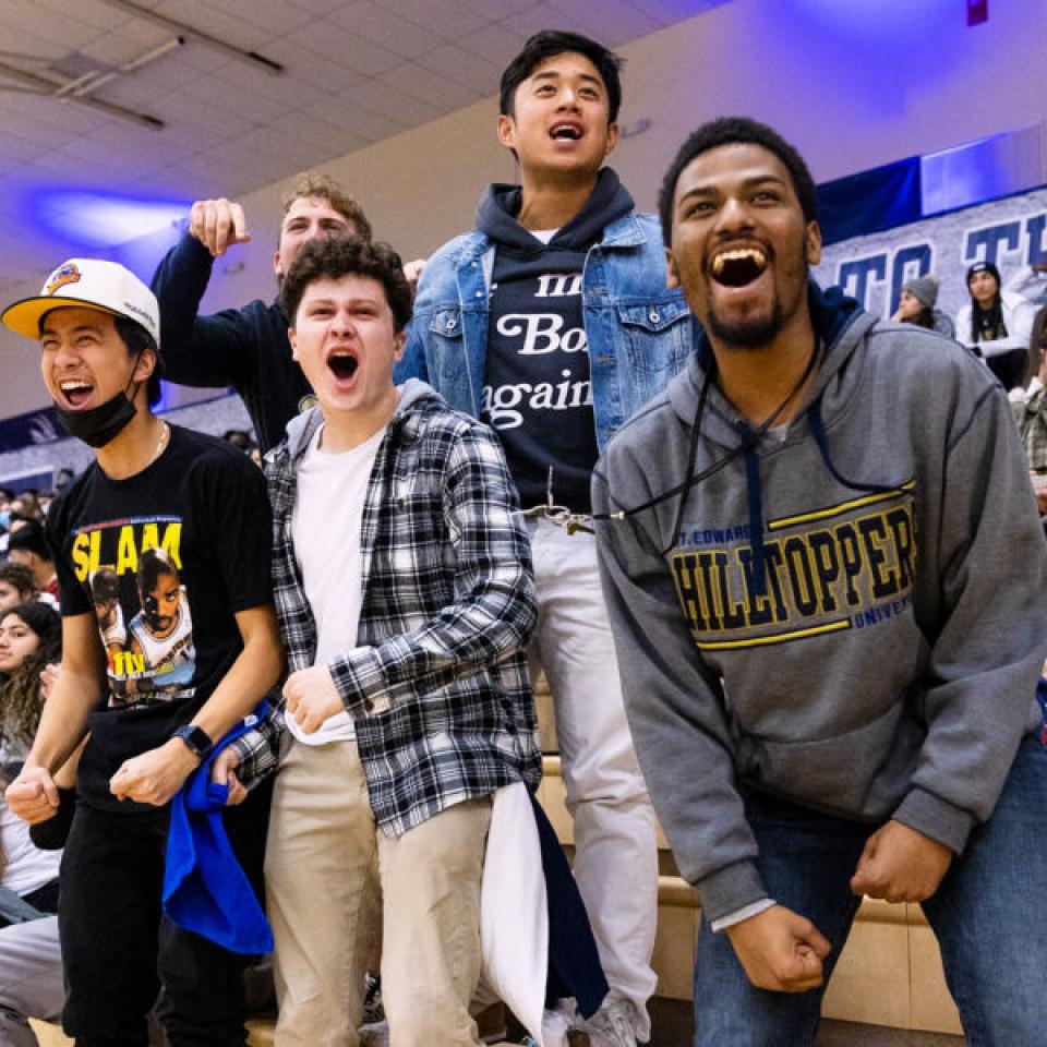 St. Edward's fans cheering at a basketball game