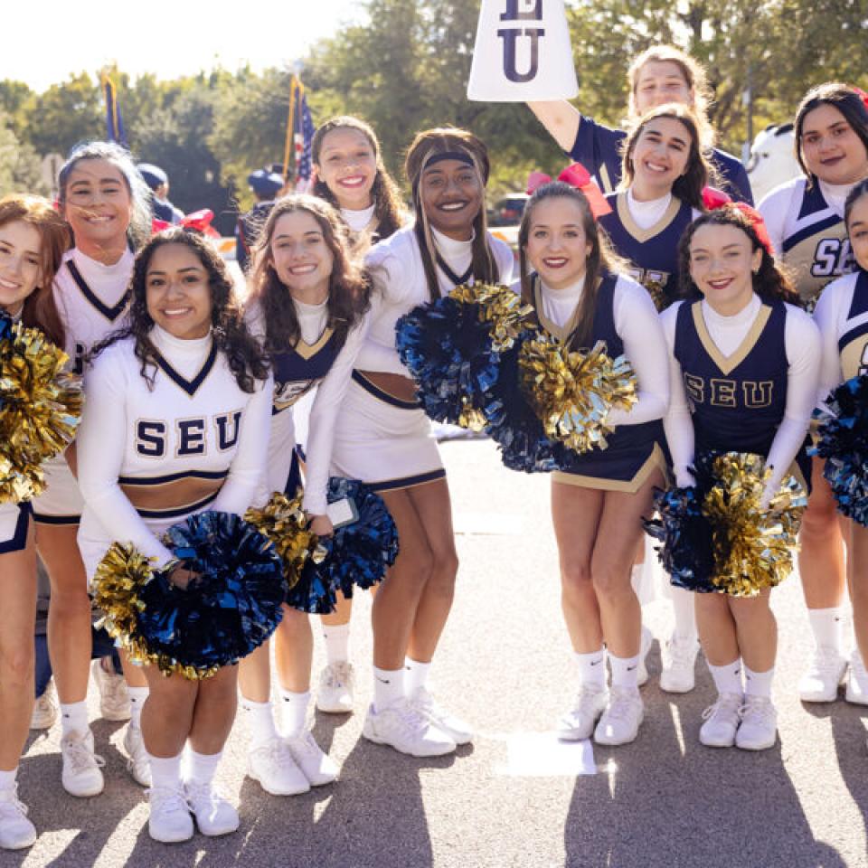 Cheerleaders at the Homecoming parade 