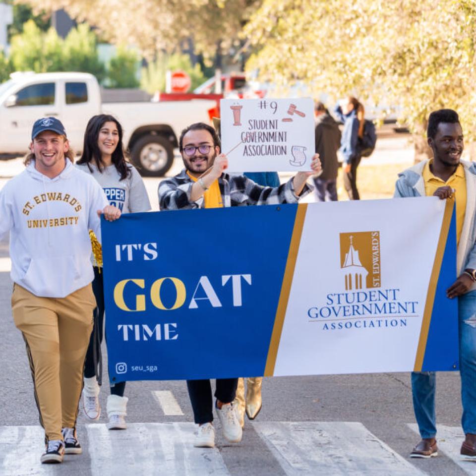 students holding Student Government banner