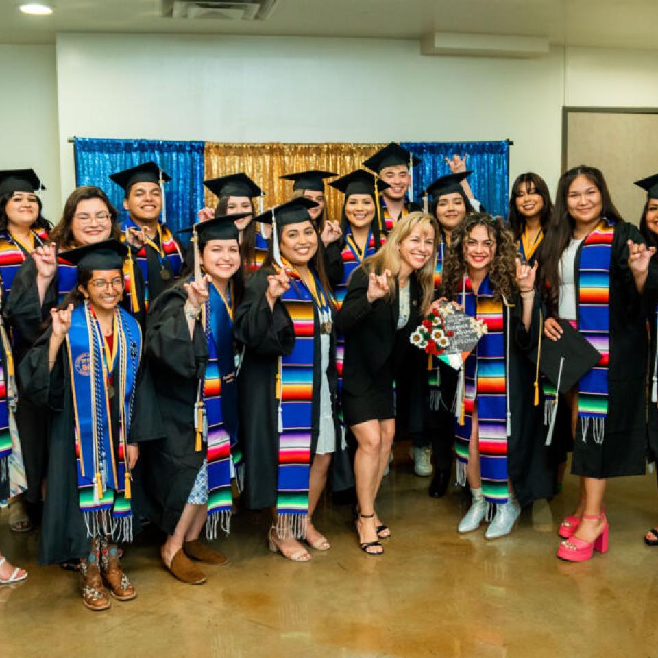 group photo of camp students with cap and gown