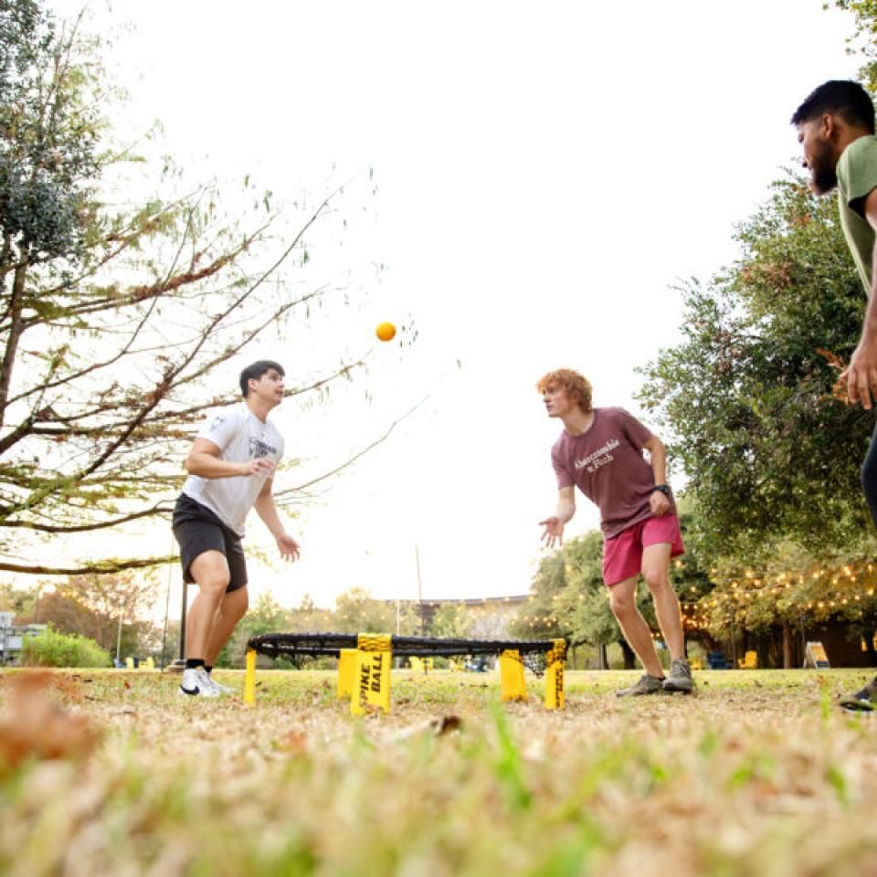 Ethan Burd plays spike ball with friends