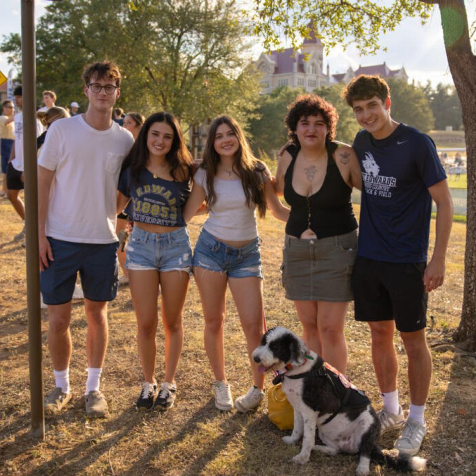 Students pose for a group photo during the block party at Anchors Weekend.