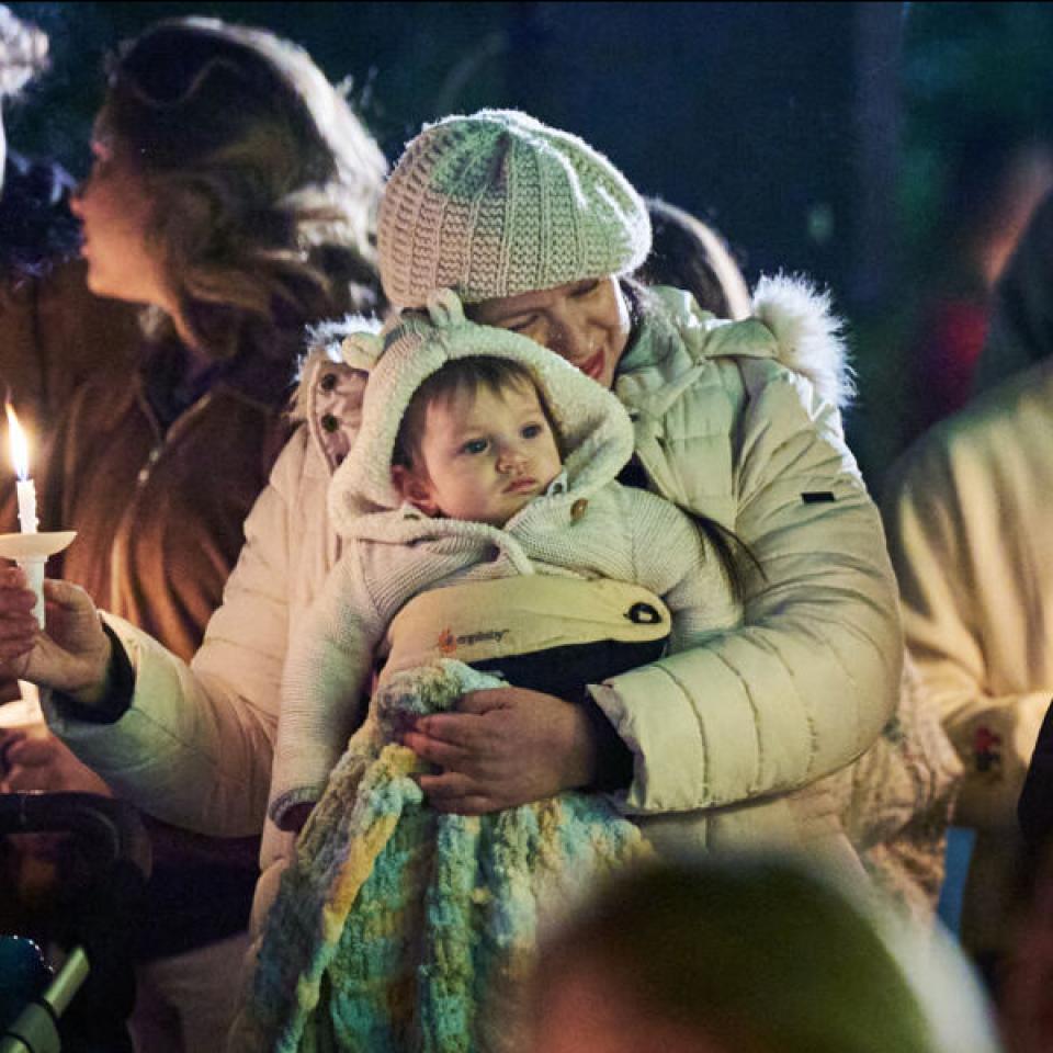 Families gather for the Festival of Lights celebration in front of Main Building.