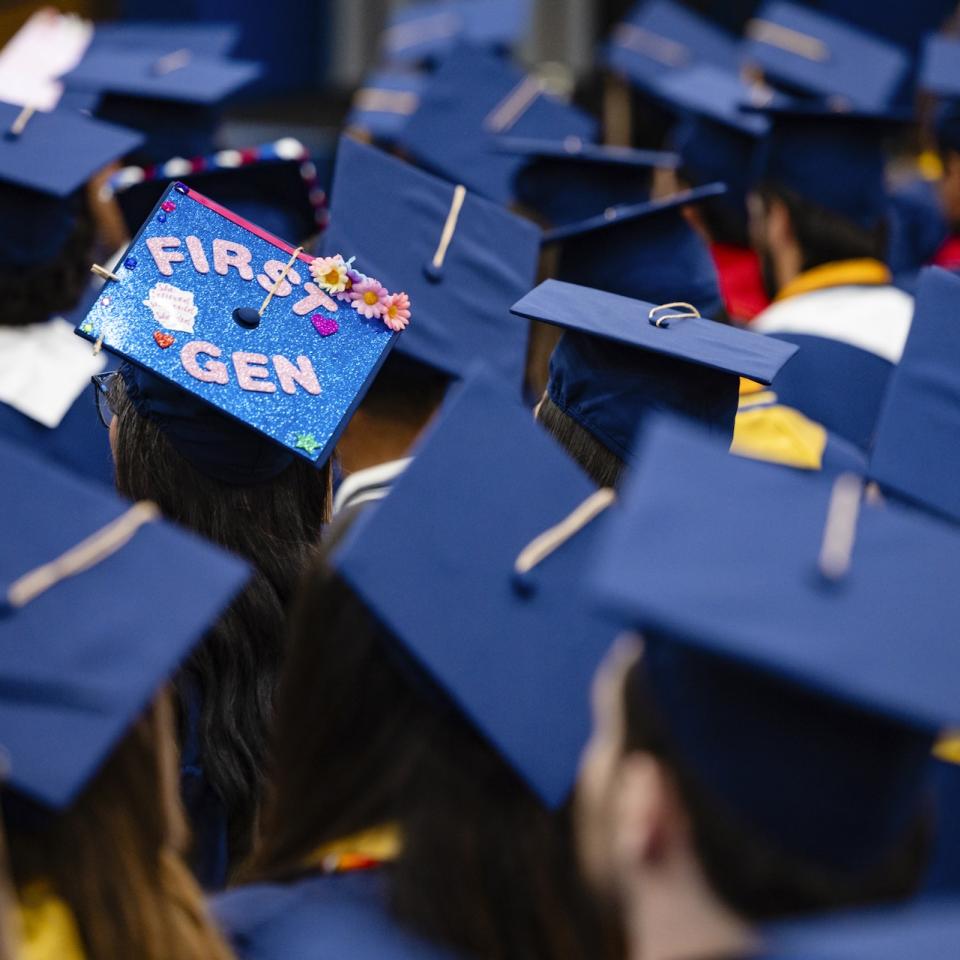 First Gen student's graduation cap decorated amongst others