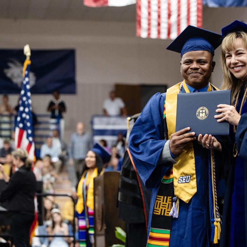 First Gen Student taking photo with Dr. Fuentes