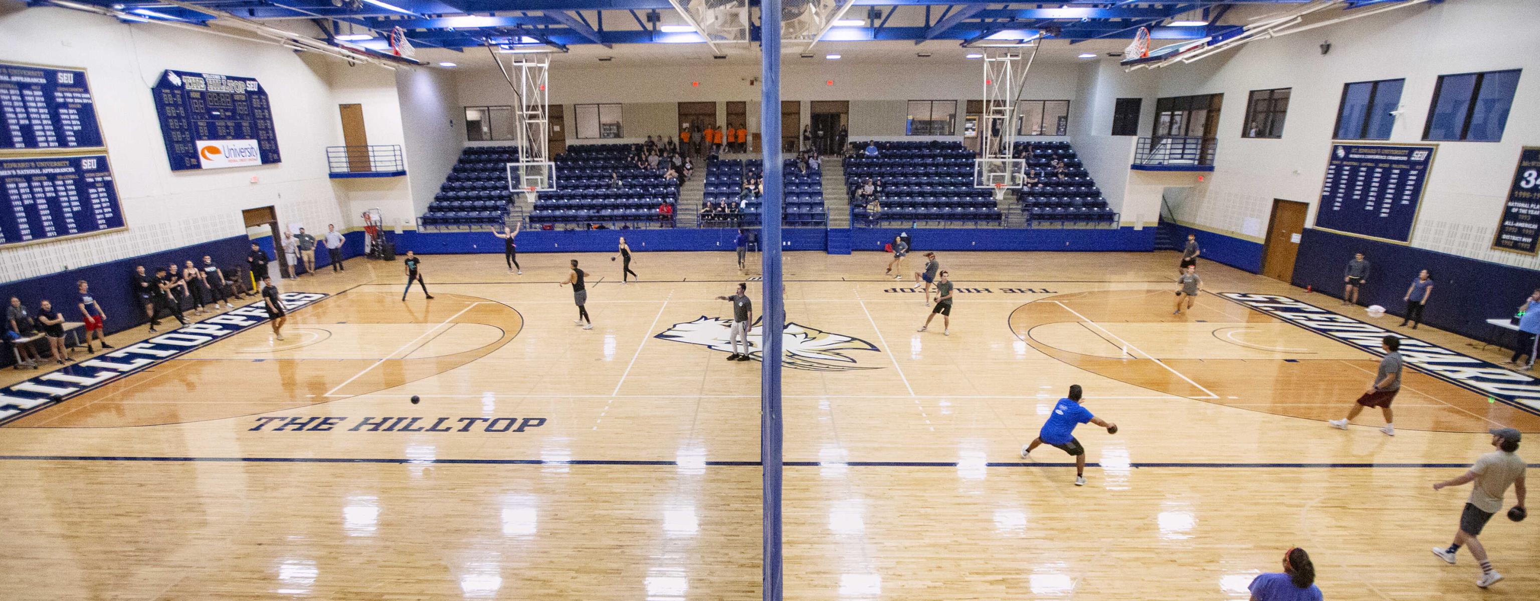 Playing dodgeball in the gym at St. Edward's University