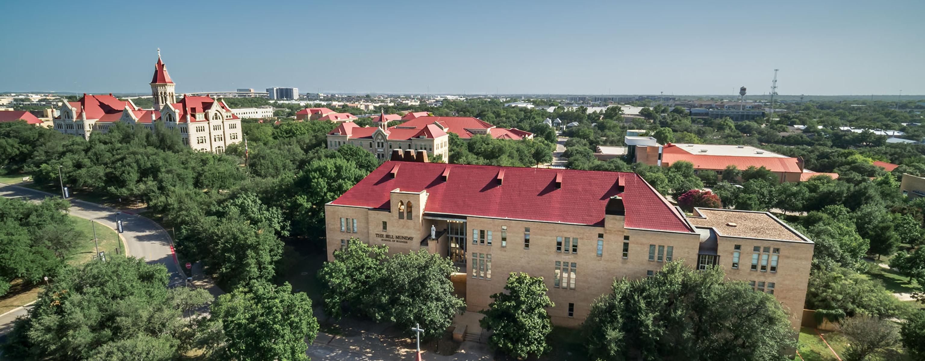 Aerial view of Main Building and the Bill Munday School of Business at St. Edward's University in Austin, Texas