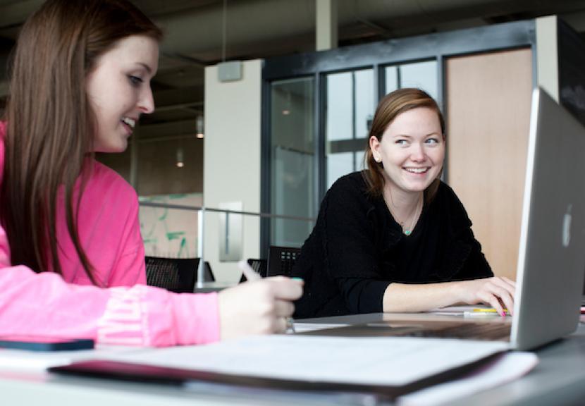 Two students at laptops