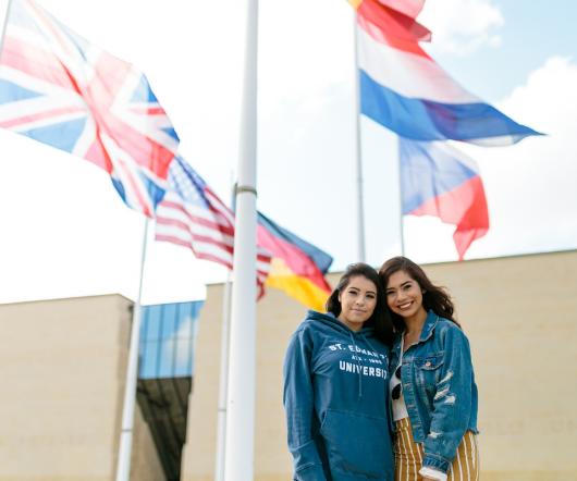 Girls in front of flags