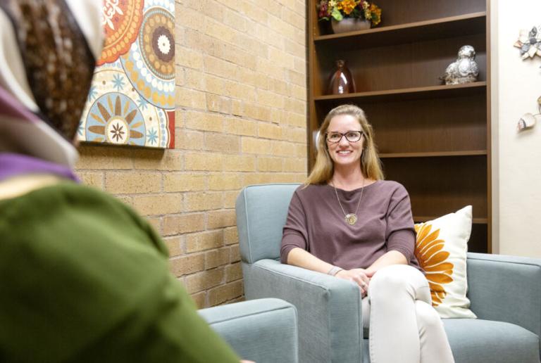 A patient and counselor talk on-campus at the community counseling clinic at St. Edward's University.
