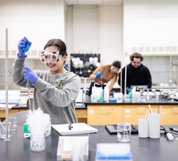 A student in a science lab in the Natural Sciences
