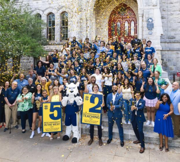 President Montserrat Fuentes and Hilltoppers celebrate the 2026 U.S. News & World Report rankings announcement in front of Main Building.