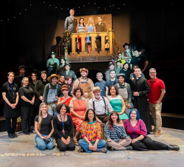 Cast photo from Much Ado About Nothing. Included stage hands and actors in costume on an Italian inspired set.