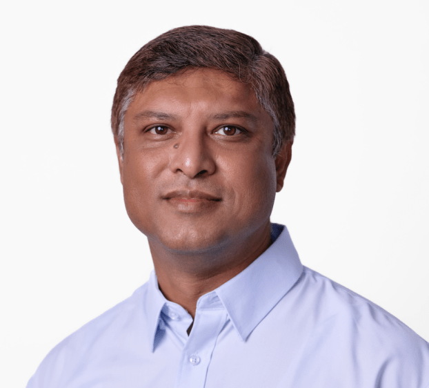 A headshot of a man with short wearing a shirt
