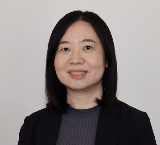 A photo of a woman smiling and with dark hair