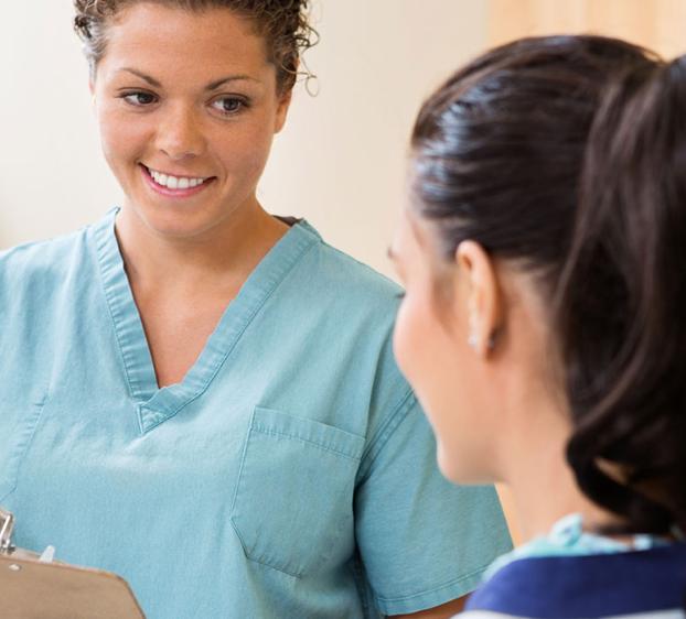 Certified clinical medical assistant at work with a patient.