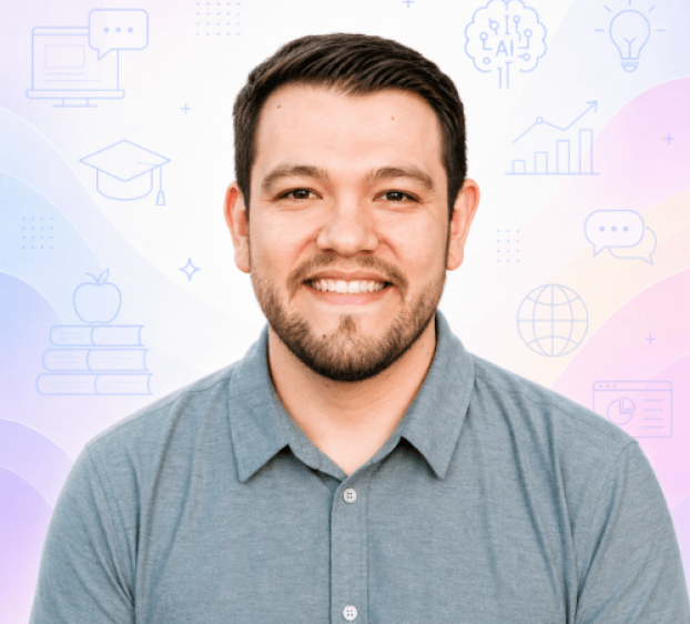 Professional headshot of a smiling man wearing a light blue collared shirt, centered against a soft pastel background