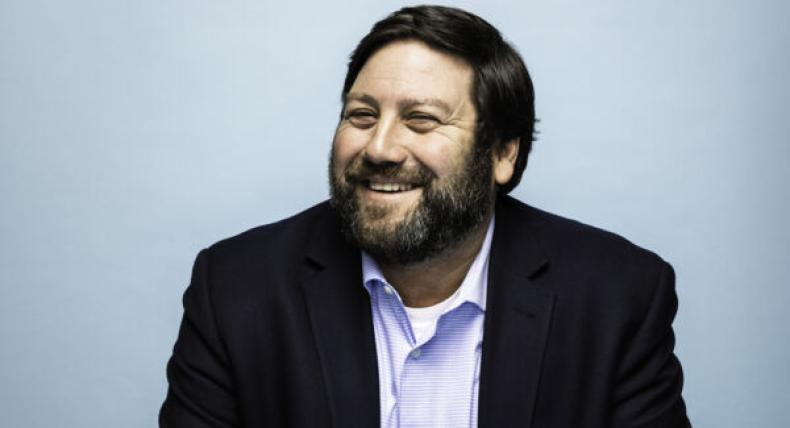 David Altounian poses for a photo in the St. Edward's University Magazine.