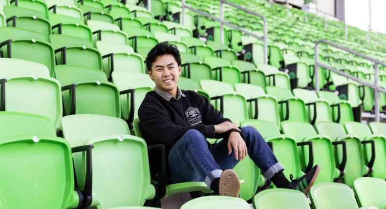 Tony Ho ’21 smiles for a photo at the Austin FC Stadium.