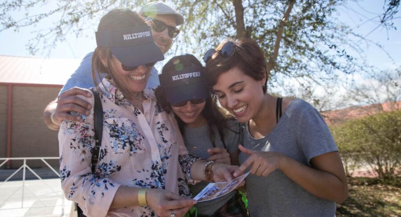 A Hilltopper family smiles during the Homecoming Tailgate. 