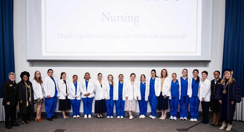 Nursing students receive their white coats at the first-ever White Coat ceremony at St. Edward's.