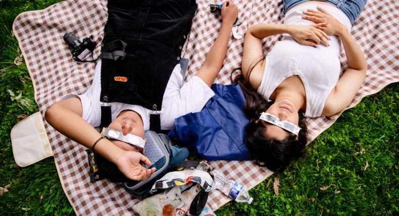 Students enjoy the Total Solar Eclipse on campus with proper eyewear