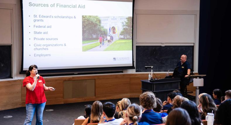 Senior Director of Student Financial Aid speaking to students on how to pay for college.