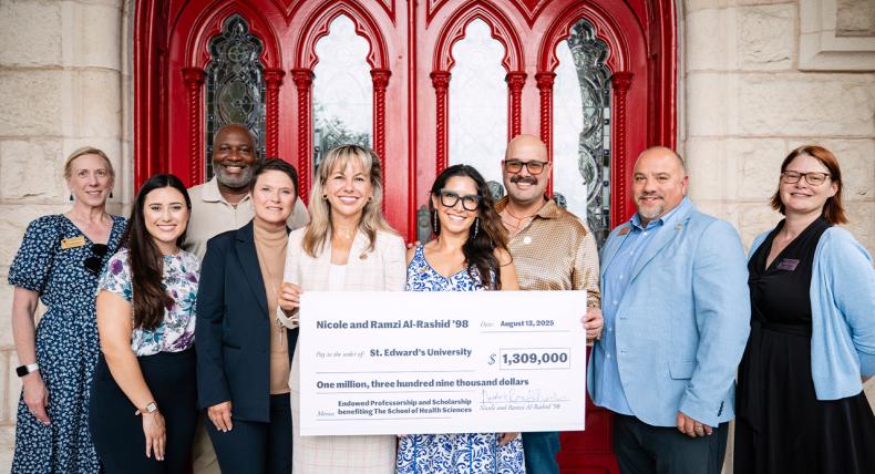President Montserrat Fuentes joins university officials at Main Building to celebrate as a check is presented to the School of Health Sciences.