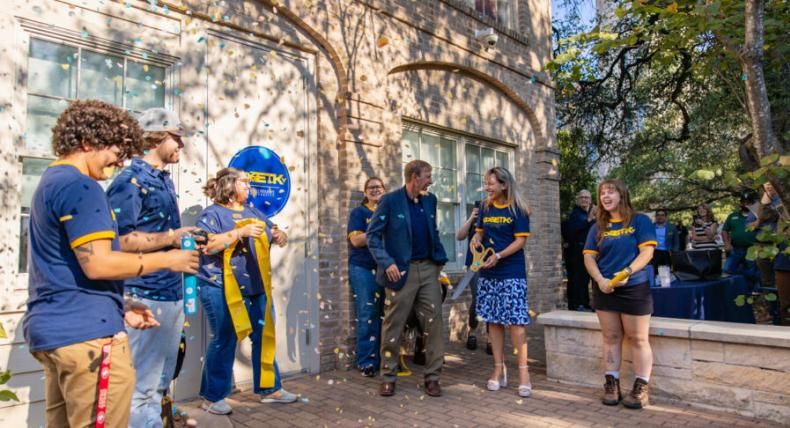 President Montserrat Fuentes joins faculty and staff to celebrate the opening of the new Kozmetsky Center space at the historic Carriage House.