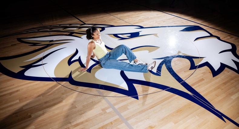 Suni Davis poses on the gym court