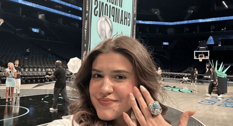Matilda Soric at WNBA Championship game with a championship ring on her finger