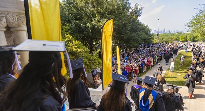 Students exit the Red Doors at the 2022 Spring Legacy Walk.