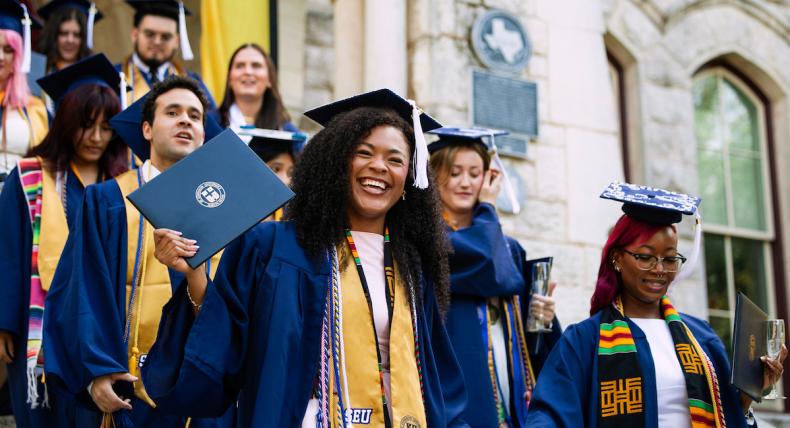 Graduates Exit Main Building During Legacy Walk