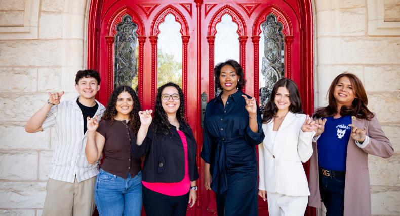 From Riverbats to Hilltoppers, our transfer students from ACC pose with Toppers Up in front of the Red Doors.