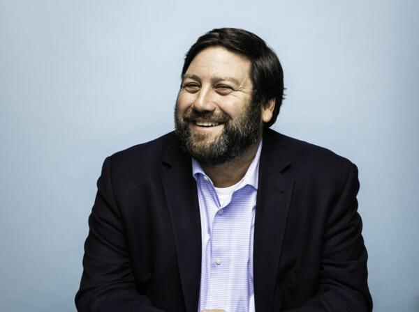 David Altounian poses for a photo in the St. Edward's University Magazine.