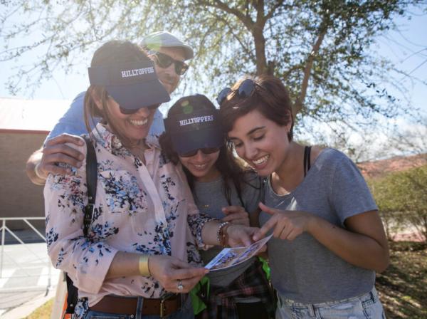 A Hilltopper family smiles during the Homecoming Tailgate. 