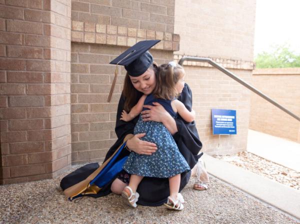 MBA student Erin Lashlee celebrates graduation with her daughter.