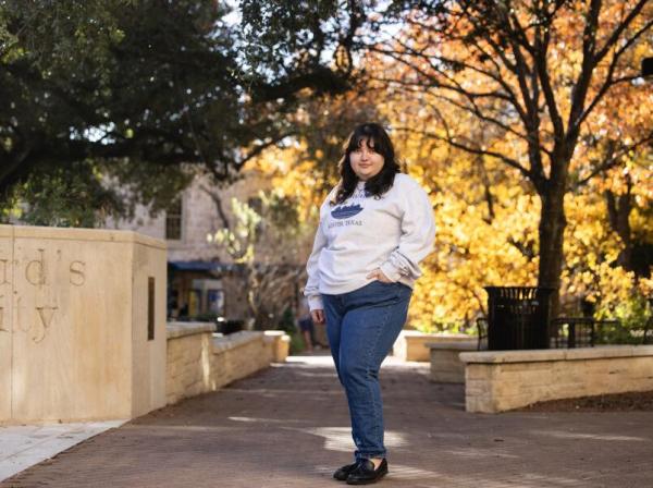 Victoria Oseguera stands on campus at St. Edward's University