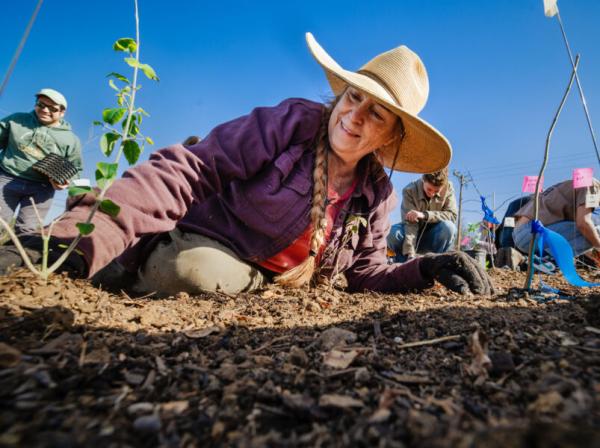 Hilltoppers and supporters gather in front of the Carriage House to celebrate the grand opening of the reimagined space for The Kozmetsky Center.