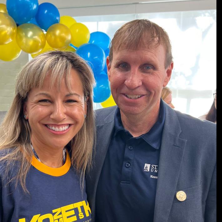 President Montserrat Fuentes celebrates the opening of the new Carriage House space for the Kozmetsky Center with David Thomason.