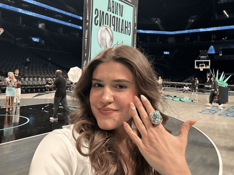 Matilda Soric at WNBA Championship game with a championship ring on her finger